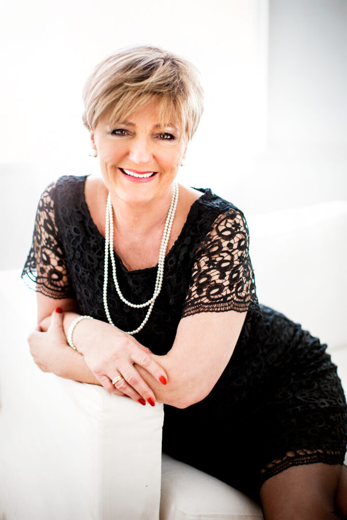 Elegant older woman in a black dress with pearls – portrait photography by Takács Bori, Budapest