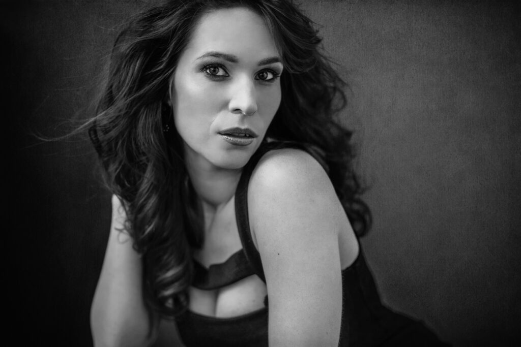 Black-and-white image of a reclining woman – glamour photography by Takács Bori, Budapest