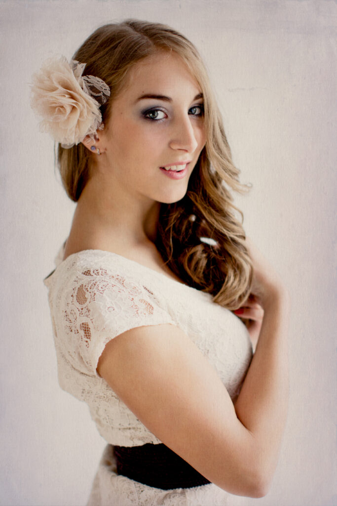 Woman in a white lace dress with a flower in her hair – glamour photography by Takács Bori, Budapest