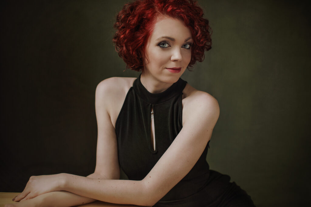 Red-haired woman in a black dress – glamour photography by Takács Bori, Budapest