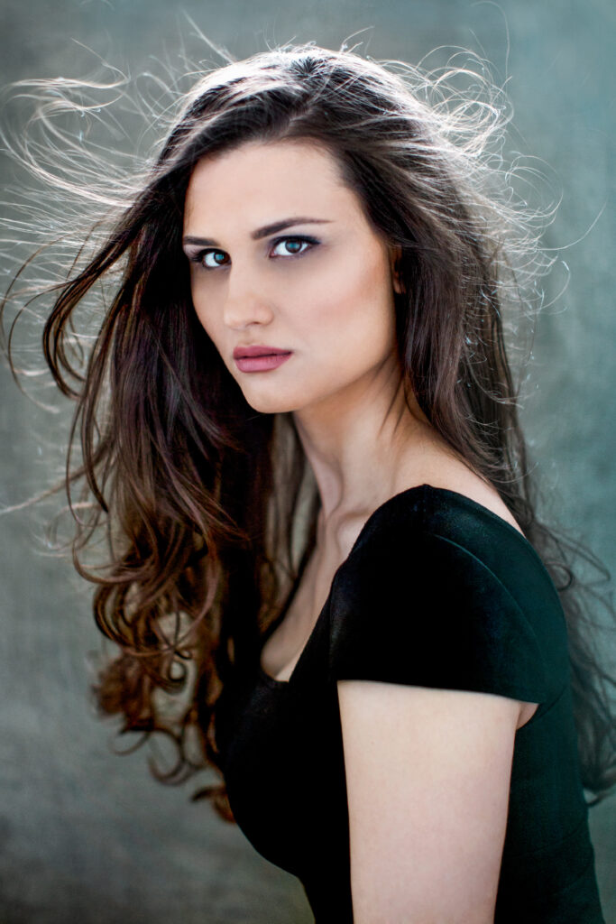 Dark-haired woman in a black top – portrait photography by Takács Bori, Budapest